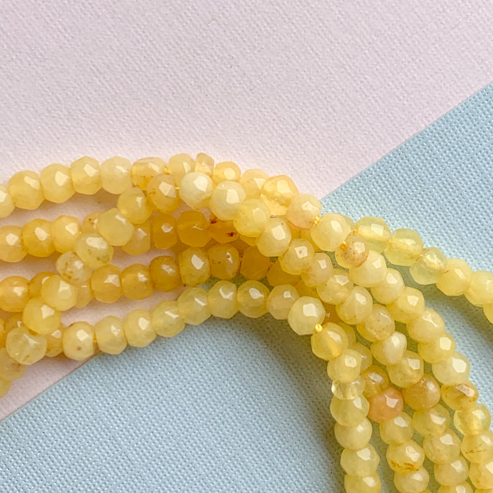 
                
                    Load image into Gallery viewer, 4mm Daffodil Faceted Dyed Jade Rondelle Strand
                
            