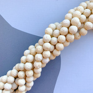 
                
                    Load image into Gallery viewer, 10mm Cream Lava Rounds Strand - Beads, Inc.
                
            