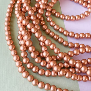 
                
                    Load image into Gallery viewer, 8mm Rose Gold Wood Rounds Strand
                
            