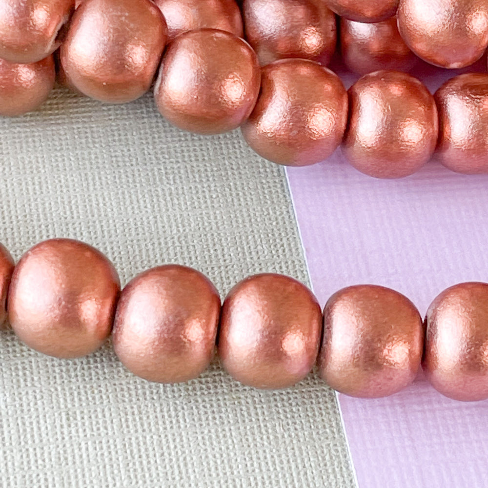 
                
                    Load image into Gallery viewer, 8mm Rose Gold Wood Rounds Strand
                
            