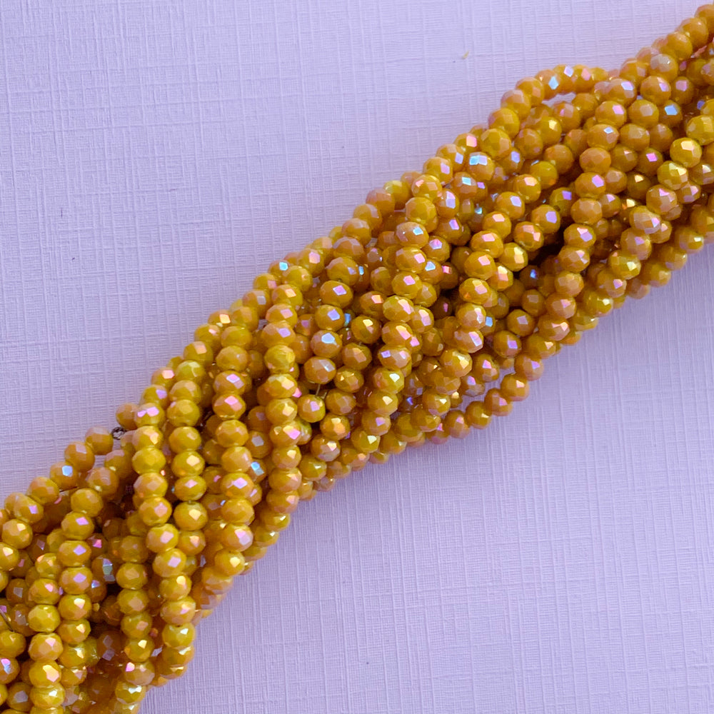 
                
                    Load image into Gallery viewer, 4mm Mystic Mustard Faceted Chinese Crystal Rondelle Strand
                
            
