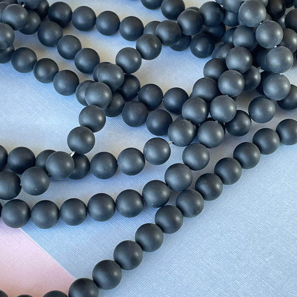 
                
                    Load image into Gallery viewer, 8mm Matte Black Onyx Rounds Strand
                
            