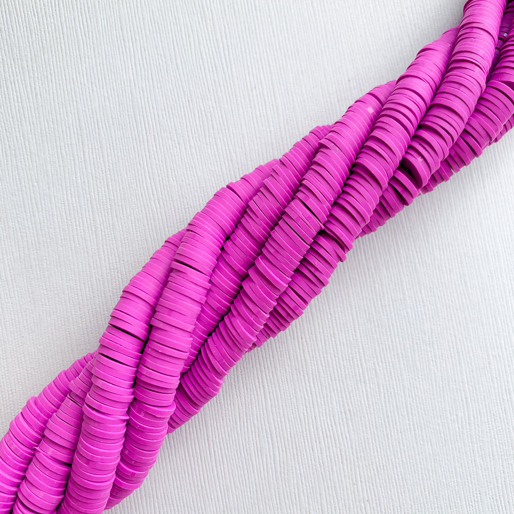 
                
                    Load image into Gallery viewer, 8mm Royalish Purple Polymer Clay Heishi Strand
                
            