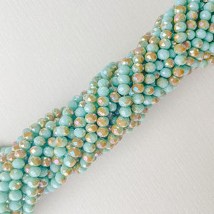 
                
                    Load image into Gallery viewer, 4mm Two-Tone Turquoise Faceted Chinese Crystal Rondelle Strand
                
            
