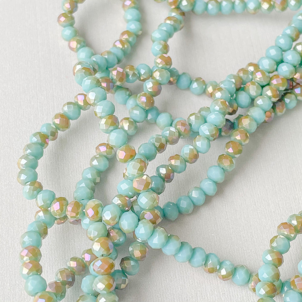 
                
                    Load image into Gallery viewer, 4mm Two-Tone Turquoise Faceted Chinese Crystal Rondelle Strand
                
            