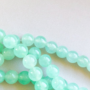 
                
                    Load image into Gallery viewer, 8mm Mint Dyed Jade Rounds Strand
                
            