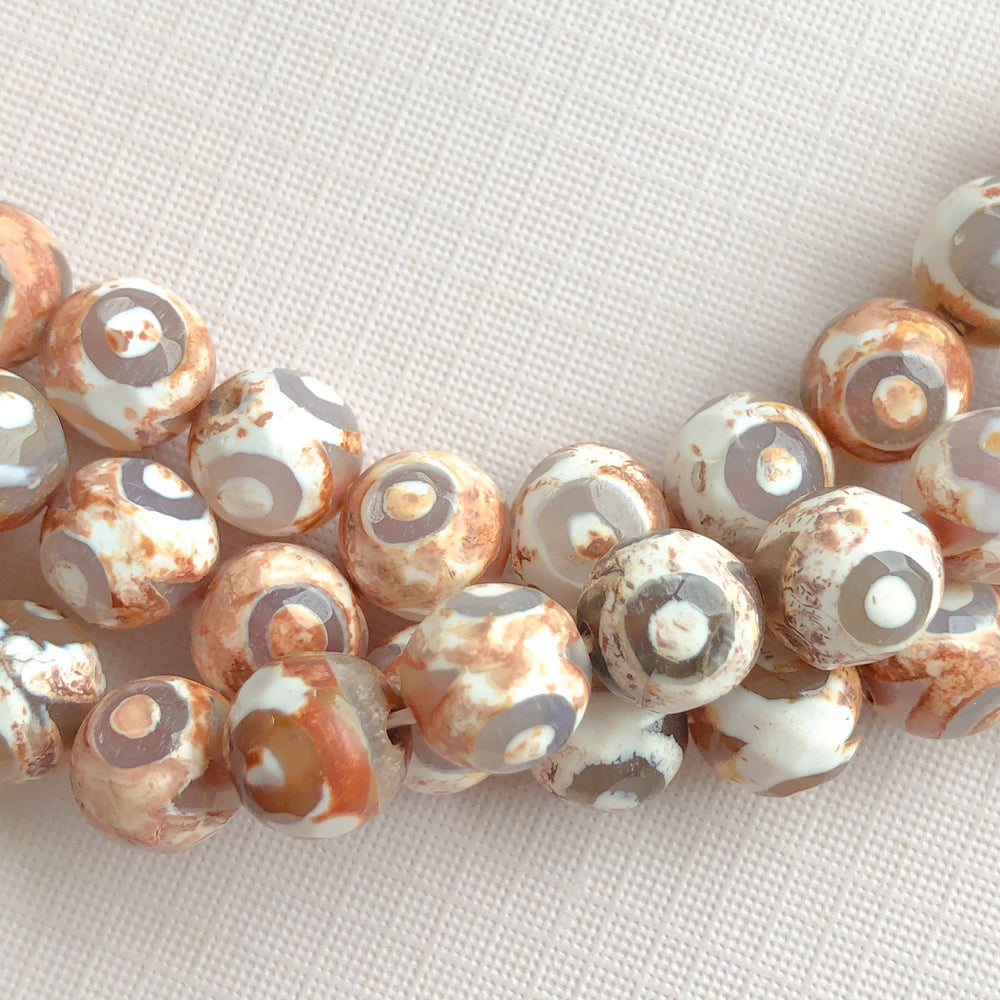 
                
                    Load image into Gallery viewer, 8mm Faceted Bullseye Agate Rounds Strand - Beads, Inc.
                
            
