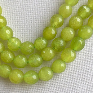 
                
                    Load image into Gallery viewer, 8mm Lime Green Faceted Dyed Rounds Strand - Christine White Style
                
            