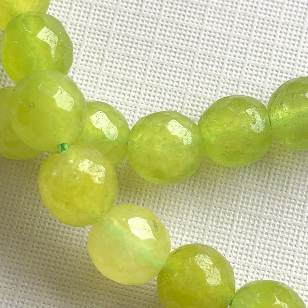 
                
                    Load image into Gallery viewer, 8mm Lime Green Faceted Dyed Rounds Strand - Christine White Style
                
            