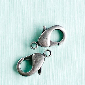 
                
                    Load image into Gallery viewer, 19mm Distressed Silver Lobster Claw Clasp - Pack of 2
                
            
