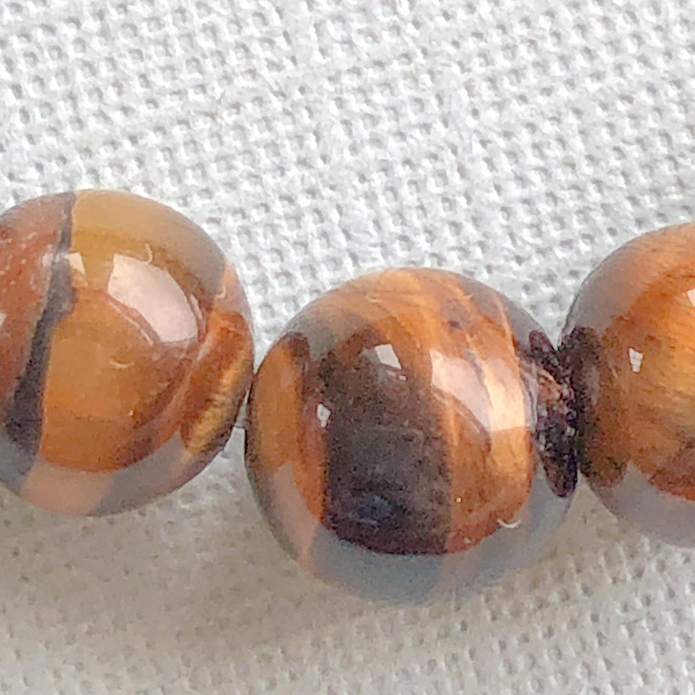 
                
                    Load image into Gallery viewer, 6mm Smooth Round Tigers Eye - Christine White Style
                
            