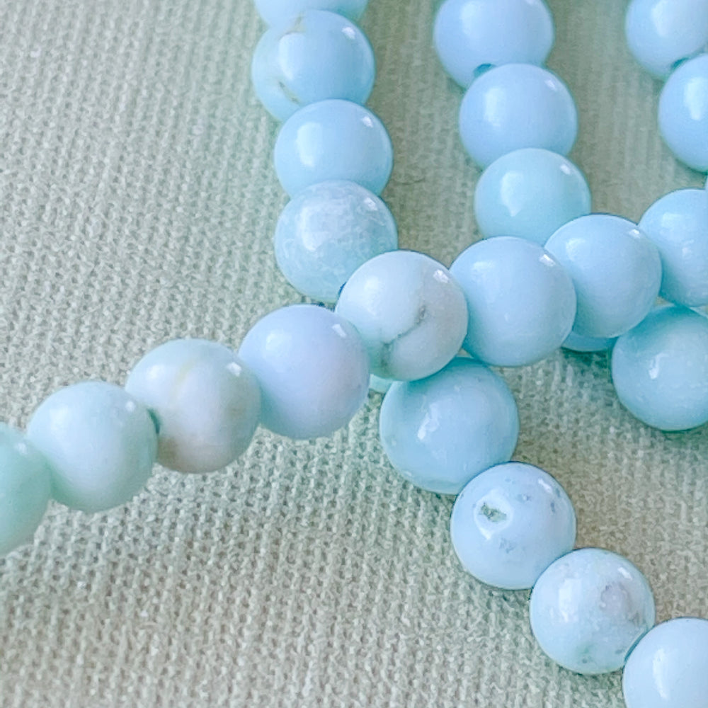
                
                    Load image into Gallery viewer, 4mm Light Blue Imperial Jasper Rounds Strand
                
            