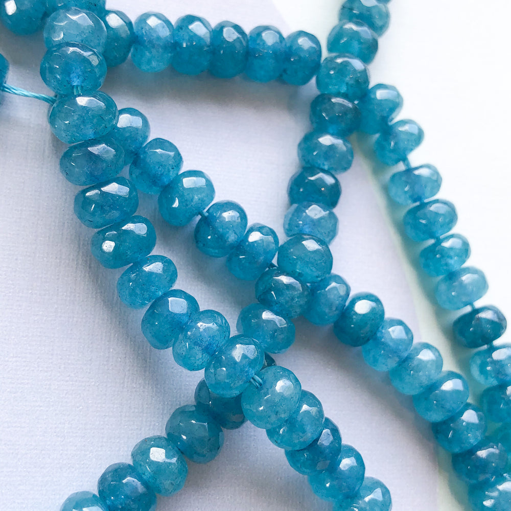 
                
                    Load image into Gallery viewer, 8mm Waterfall Blue Dyed Jade Rondelle Strand
                
            