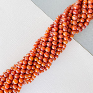 
                
                    Load image into Gallery viewer, 4mm Smooth Bamboo Coral Rounds Strand
                
            