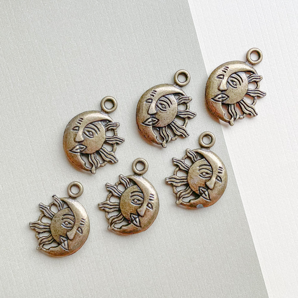 
                
                    Load image into Gallery viewer, 21mm Antique Brass Sun + Moon Face Charm - 6 Pack
                
            