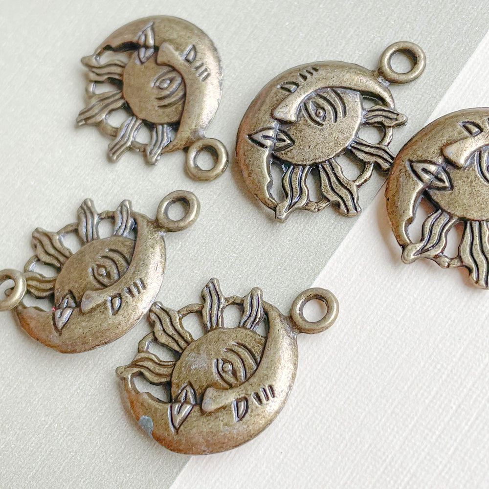 
                
                    Load image into Gallery viewer, 21mm Antique Brass Sun + Moon Face Charm - 6 Pack
                
            