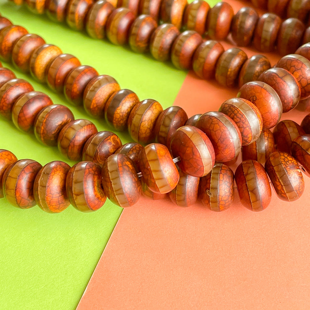 
                
                    Load image into Gallery viewer, 12mm Striped DZI Crackle Chestnut Smooth Agate Rondelle Strand
                
            