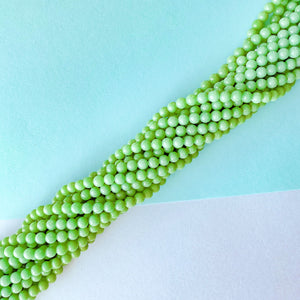 
                
                    Load image into Gallery viewer, 6mm Jungle Green Smooth Dyed Jade Round Strand
                
            