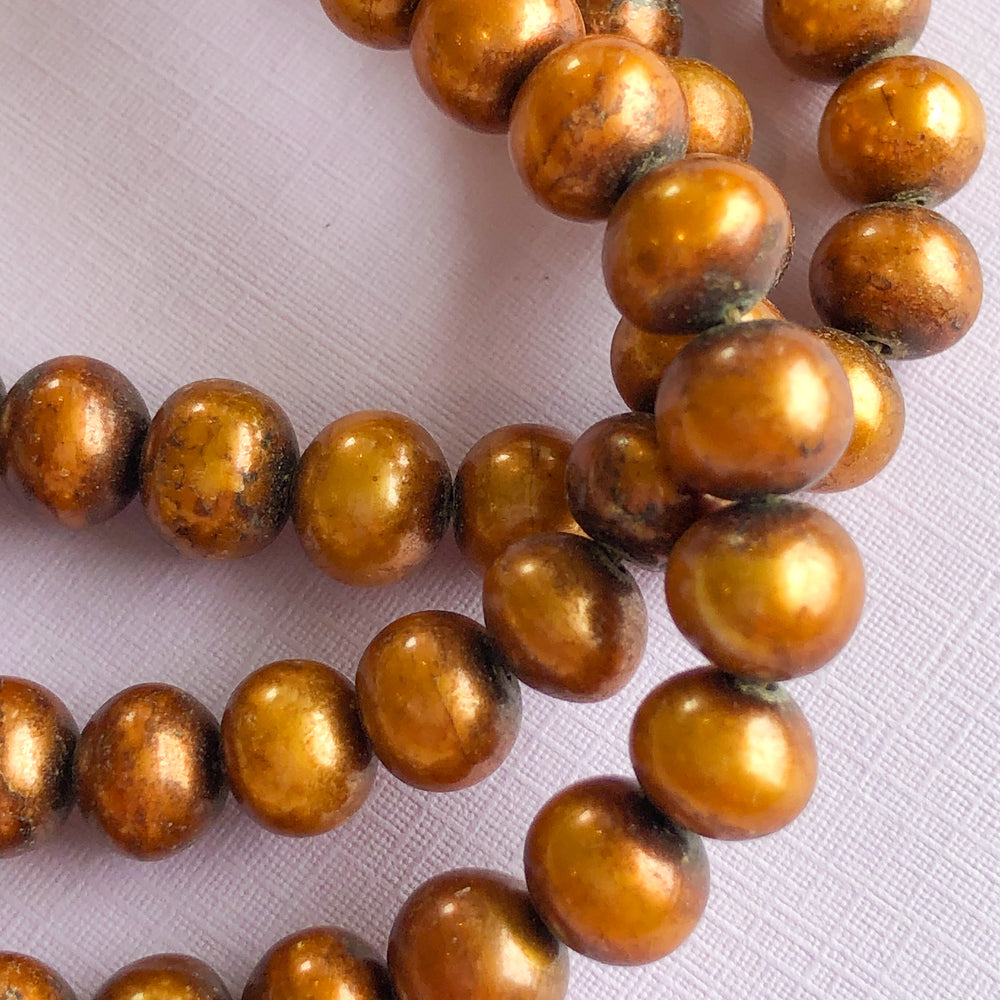 
                
                    Load image into Gallery viewer, 7mm Bronze Freshwater Pearl Strand - Christine White Style
                
            