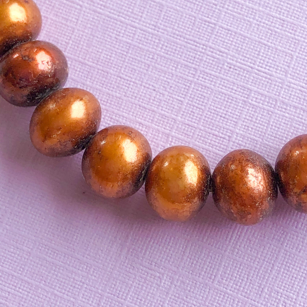 
                
                    Load image into Gallery viewer, 7mm Bronze Freshwater Pearl Strand - Christine White Style
                
            