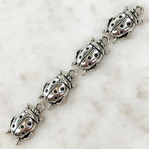 
                
                    Load image into Gallery viewer, 10mm Plated Pewter Bug Charms - 4 Pack - Christine White Style
                
            