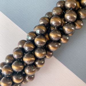 
                
                    Load image into Gallery viewer, 12mm Gold Native Resin Rounds Strand
                
            