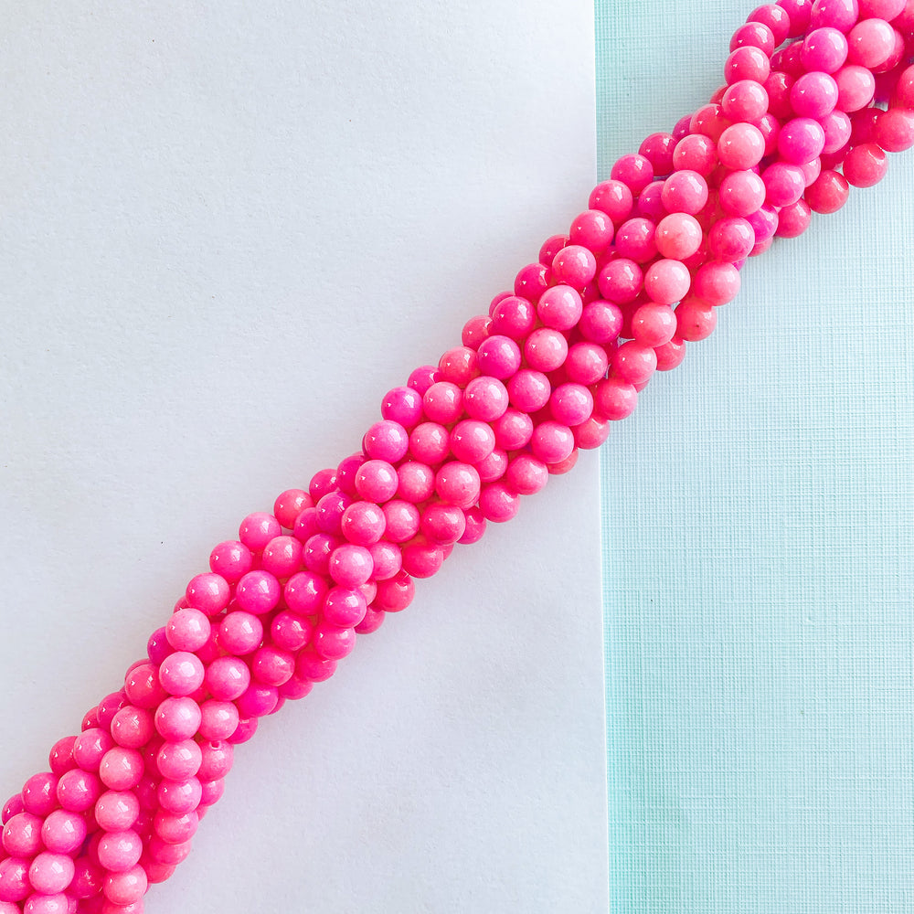 
                
                    Load image into Gallery viewer, 8mm Magenta Dyed Jade Round Strand
                
            