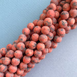 8mm Red Spotted Dyed Jade Rounds Strand