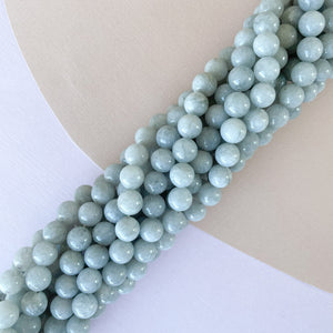 
                
                    Load image into Gallery viewer, 8mm Cloudy Gray Smooth Dyed Jade Rounds Strand
                
            