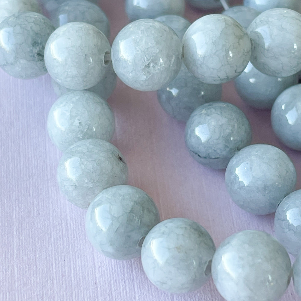 
                
                    Load image into Gallery viewer, 8mm Cloudy Gray Smooth Dyed Jade Rounds Strand
                
            
