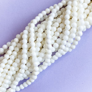 
                
                    Load image into Gallery viewer, 6mm White Mother Of Pearl Round Strand
                
            