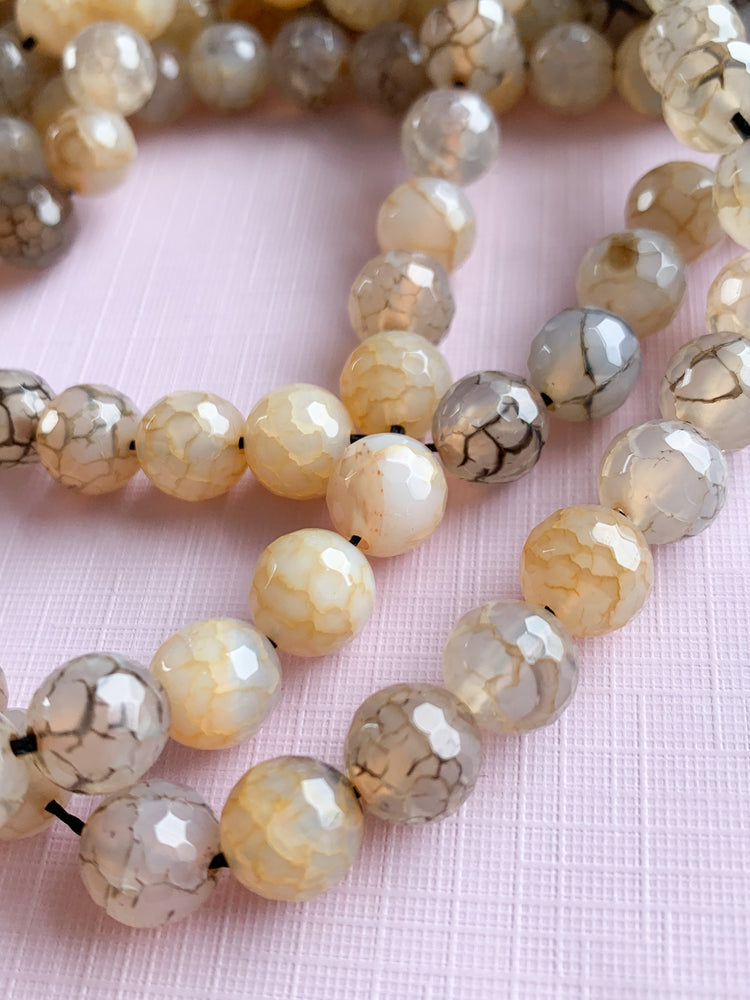 
                
                    Load image into Gallery viewer, 10mm Neutral Crackle Agate Round Strand
                
            