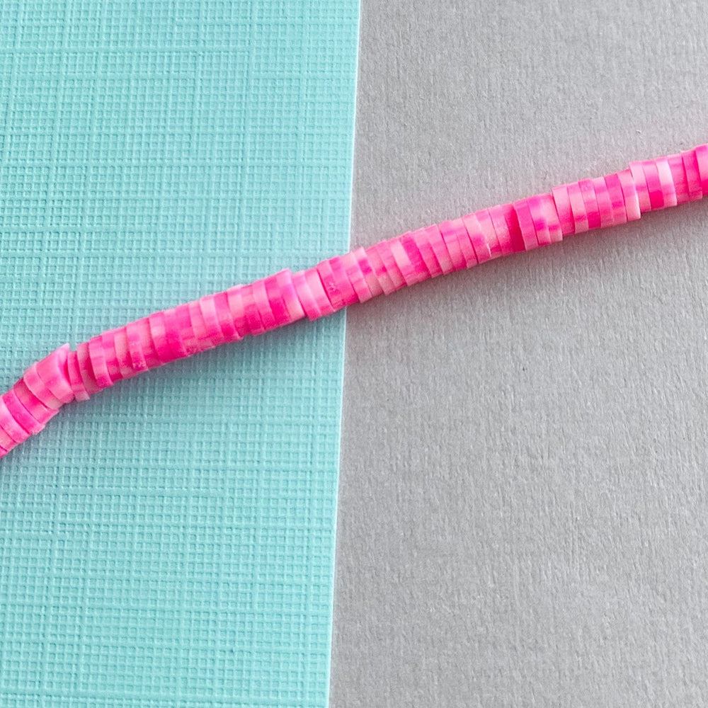 
                
                    Load image into Gallery viewer, 4mm Strawberry Stripe Polymer Clay Heishi Strand
                
            