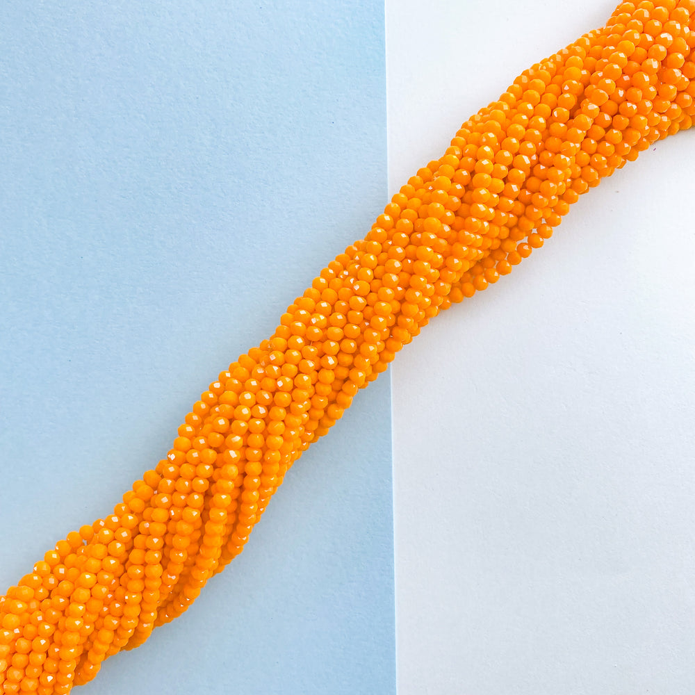 
                
                    Load image into Gallery viewer, 4mm Opaque Orange Faceted Chinese Crystal Rondelle Strand
                
            