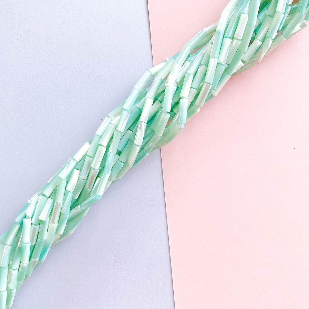 
                
                    Load image into Gallery viewer, 10mm Aqua Mother of Pearl Tubular Bead Strand
                
            