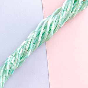
                
                    Load image into Gallery viewer, 10mm Aqua Mother of Pearl Tubular Bead Strand
                
            