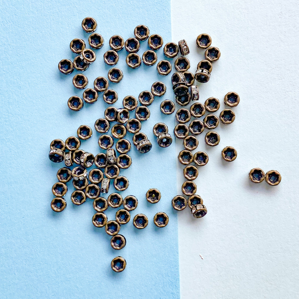 
                
                    Load image into Gallery viewer, 4mm Rhinestone Crystal Rondelle Matte Antique Bronze - 100 Pack
                
            