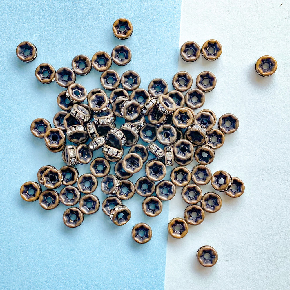 
                
                    Load image into Gallery viewer, 6mm Rhinestone Crystal Rondelle Matte Antique Bronze - 100 Pack
                
            