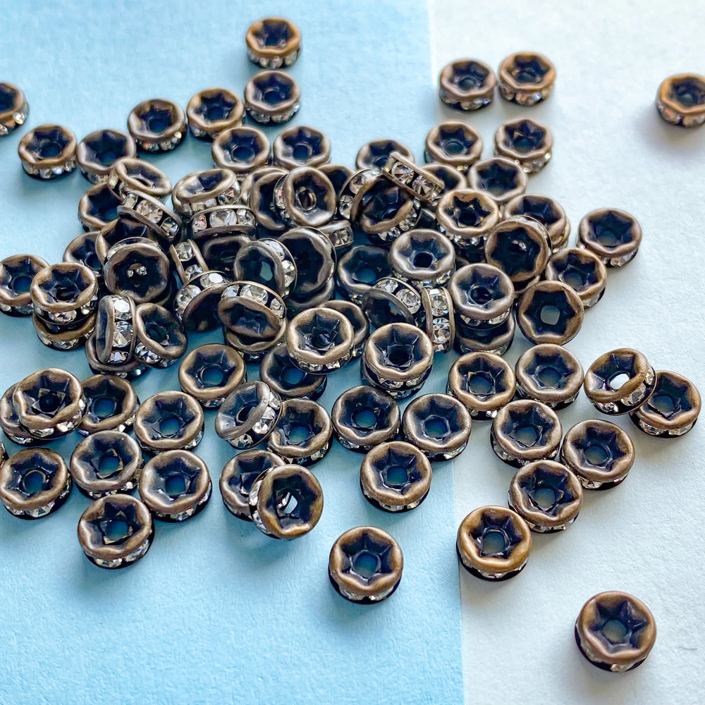 
                
                    Load image into Gallery viewer, 6mm Rhinestone Crystal Rondelle Matte Antique Bronze - 100 Pack
                
            