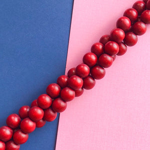 10mm Cranberry Wood Rounds Strand - Beads, Inc.
