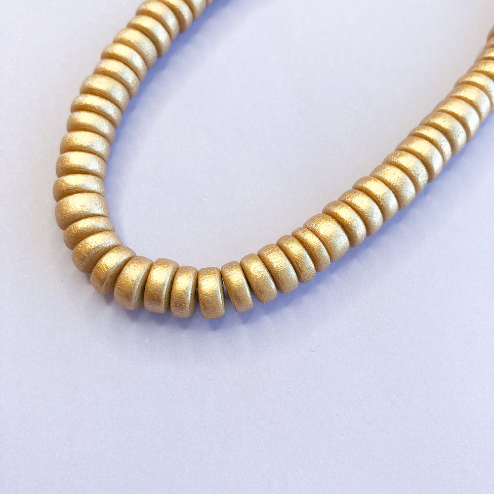 
                
                    Load image into Gallery viewer, 8mm Gold Wood Rondelle Strand - Christine White Style
                
            
