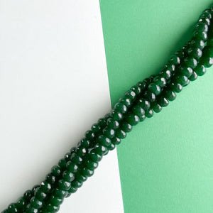 
                
                    Load image into Gallery viewer, 8mm Pine Green Faceted Dyed Jade Rondelle Strand
                
            