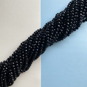 
                
                    Load image into Gallery viewer, 8mm Black Dyed Jade Faceted Rondelle Strand
                
            
